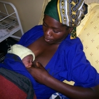 Mother nursing newborn. (Photo courtesy of Jhpiego.) Mother nursing newborn. (Photo courtesy of Jhpiego.)
